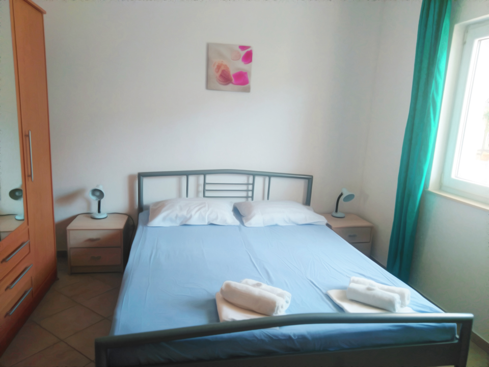 Apartments Blazenka - one of it's four separate bedrooms